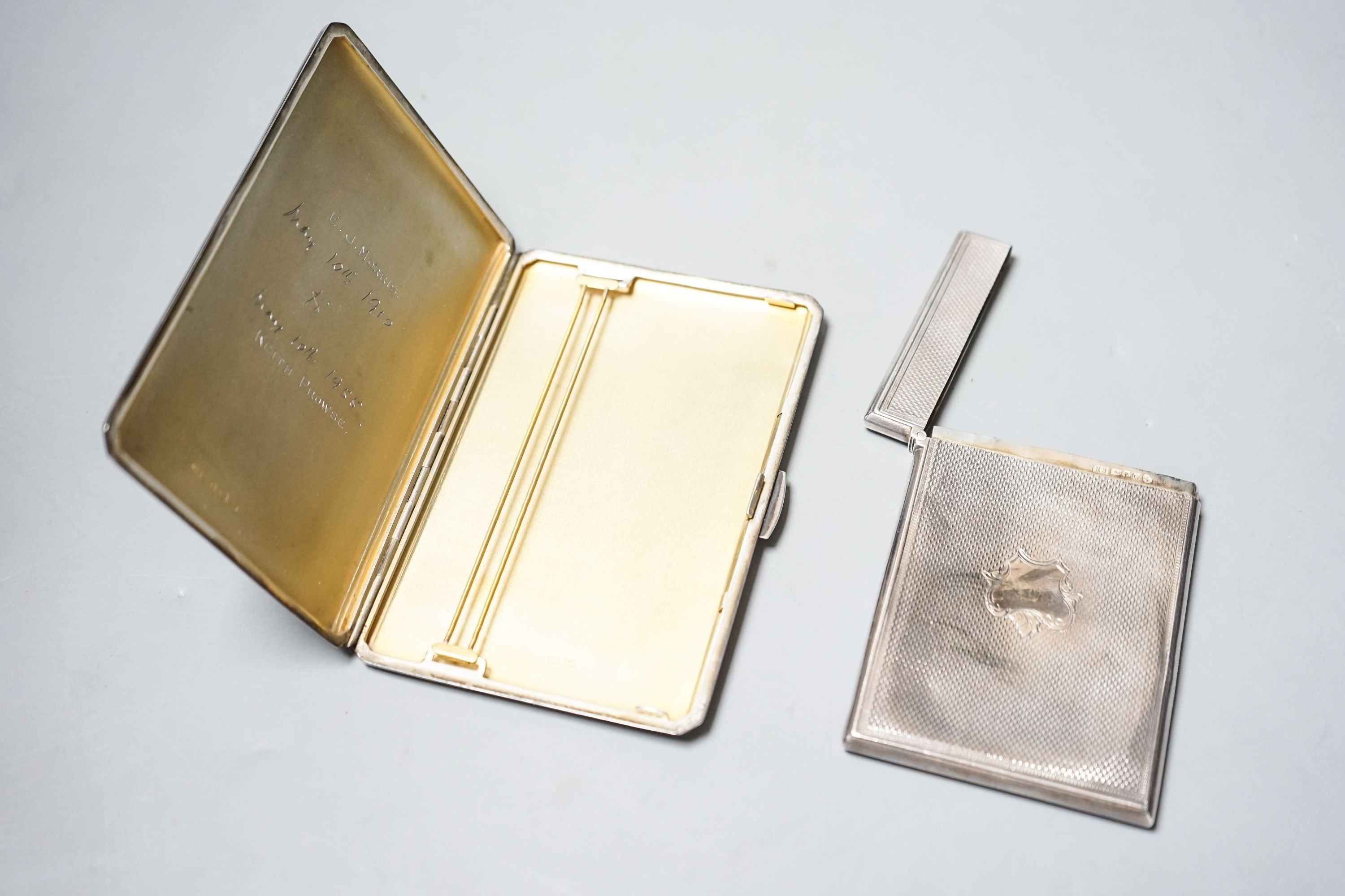 A Victorian engine turned silver card case, 95mm and a later silver cigarette case, gross 8.5oz.